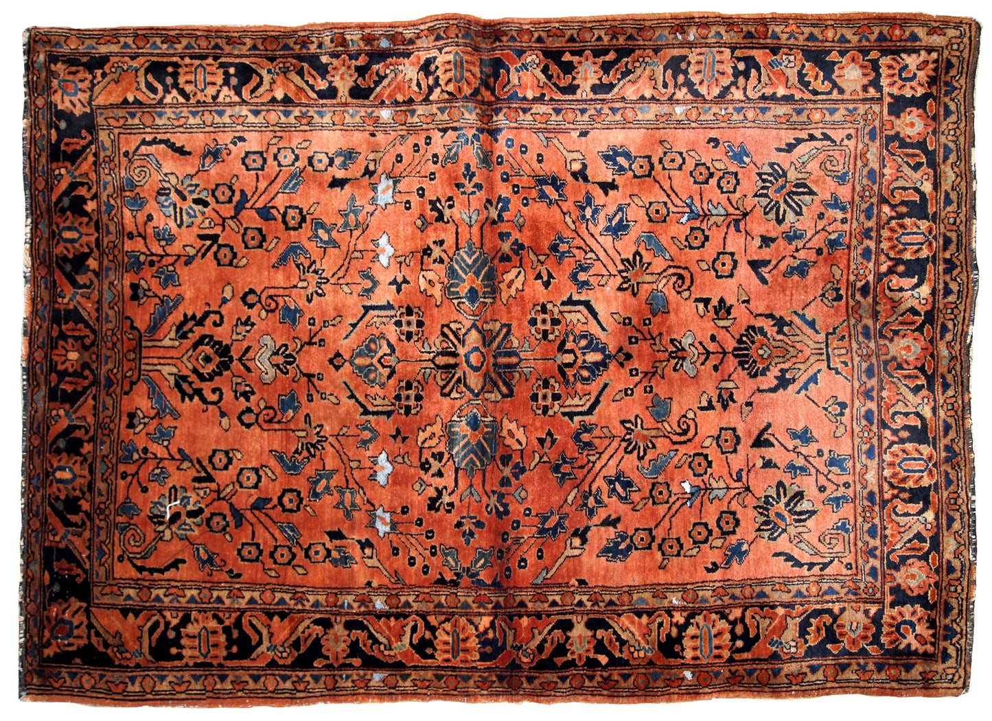 Handmade antique Sarouk rug in original good condition from 1920s.