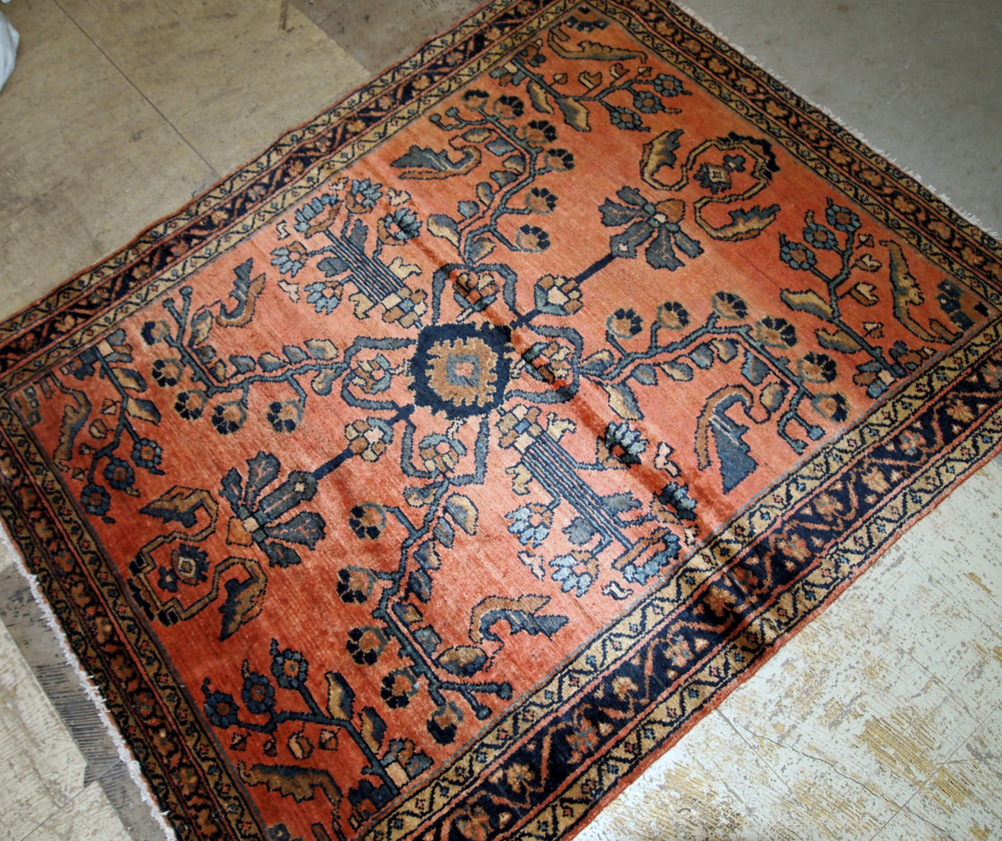 Antique hand made Lilihan rug in red shade with geometric/floral design. The rug is in original good condition from 1920s.