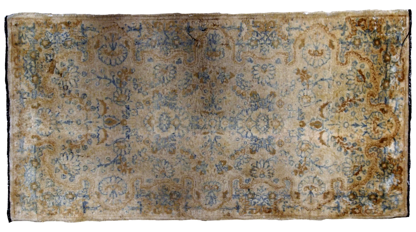 Hand made antique Persian Kerman rug in beige and sky blue shades. The rug is from the beginning of 20th century in original good condition.