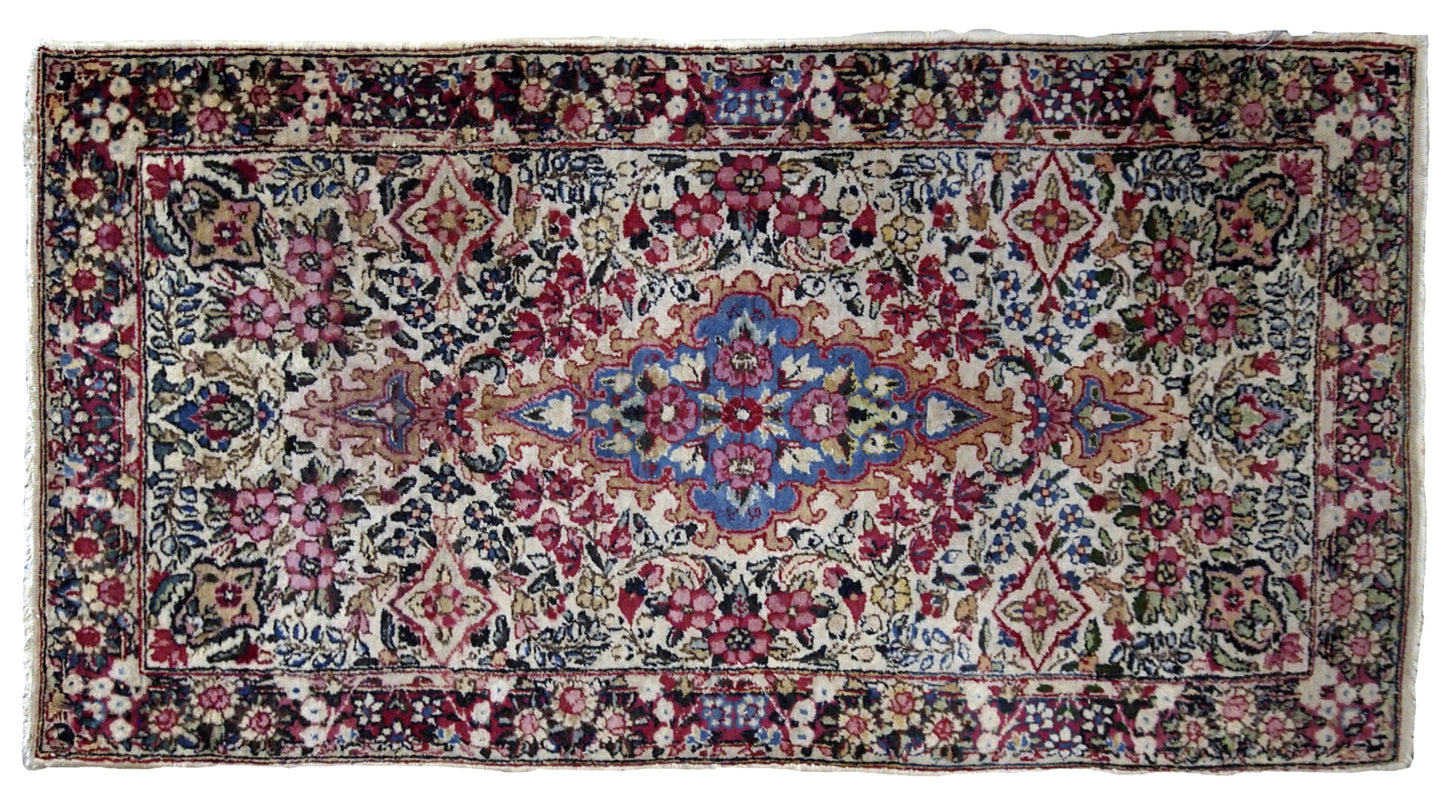 Antique handmade Persian Kerman rug in colorful shades. It is from the beginning of 20th century in original good condition.