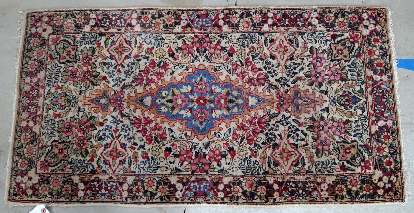 Antique handmade Persian Kerman rug in colorful shades. It is from the beginning of 20th century in original good condition.