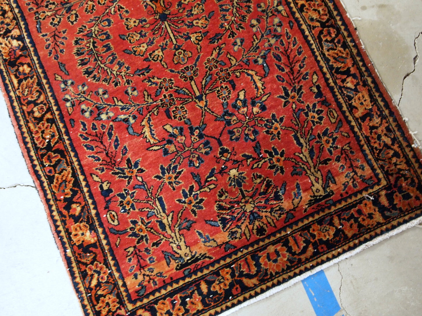 Antique hand made Persian Sarouk runner in red wool and floral design. The rug made in 1900s and it is in original good condition.