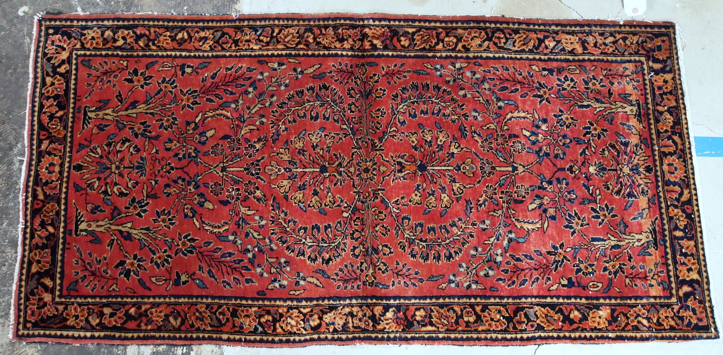 Antique hand made Persian Sarouk runner in red wool and floral design. The rug made in 1900s and it is in original good condition.