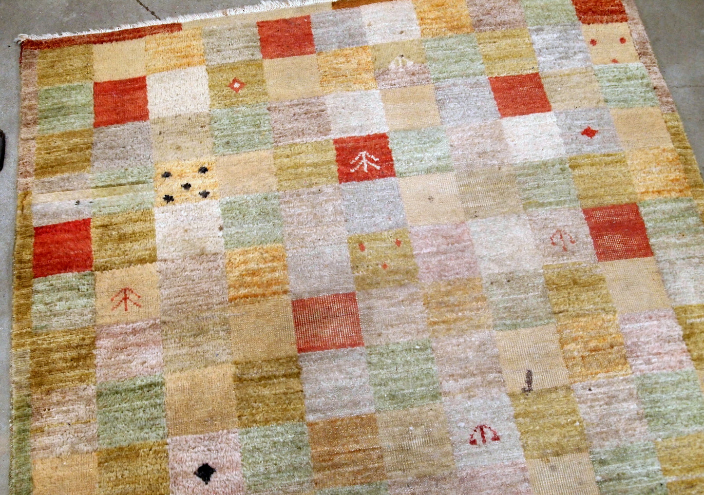 Vintage Chinese modern rug in colorful shades. The rug made in wool in the end of 20th century, it has some low pile due to age.