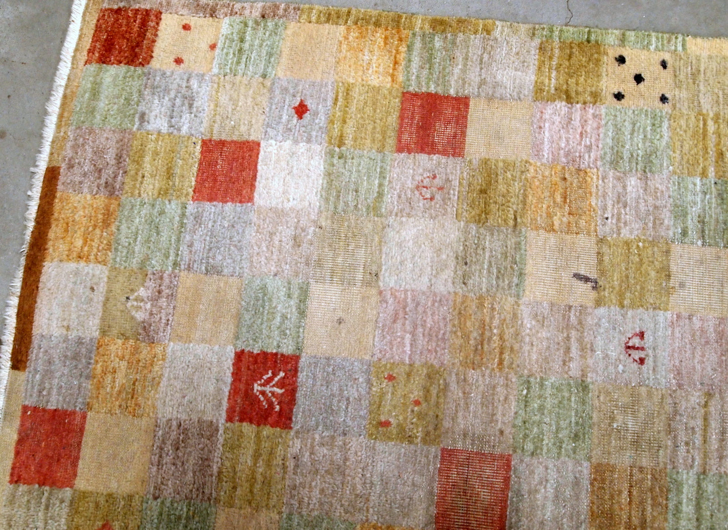 Vintage Chinese modern rug in colorful shades. The rug made in wool in the end of 20th century, it has some low pile due to age.