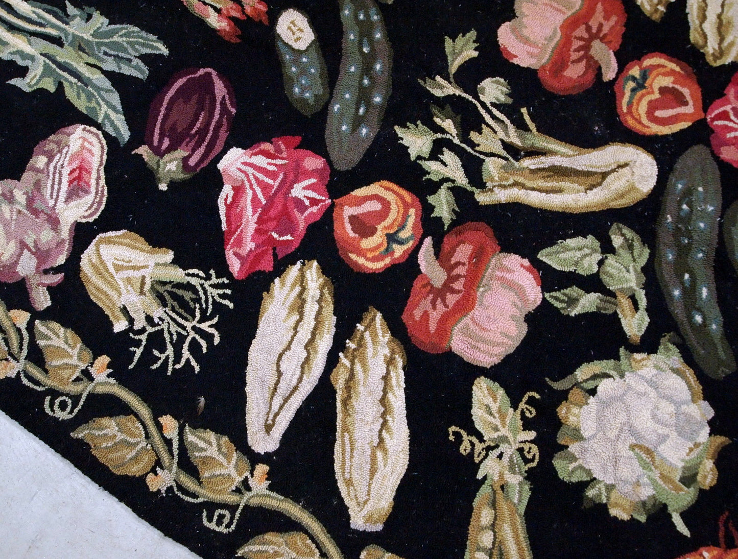 Handmade antique American Hooked rug in black color with variety of vegetables. This rug has been made in the beginning of 20th century, it remains in original good condition.