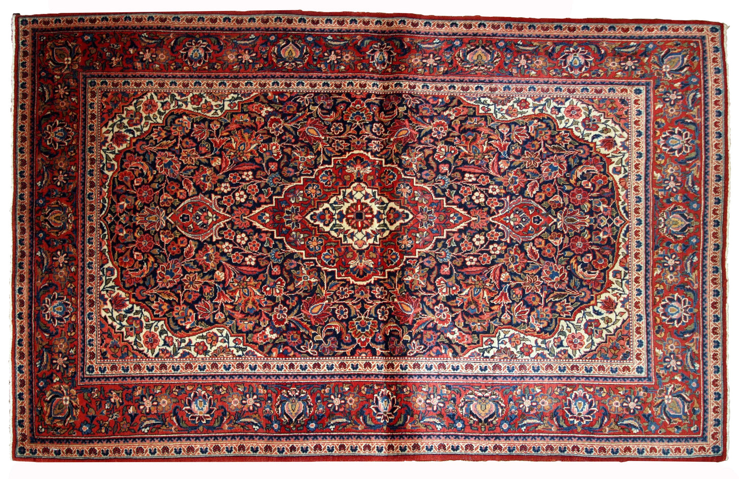 Handmade antique Kashan rug in traditional floral design. The rug is in original good condition from the beginning of 20th century.