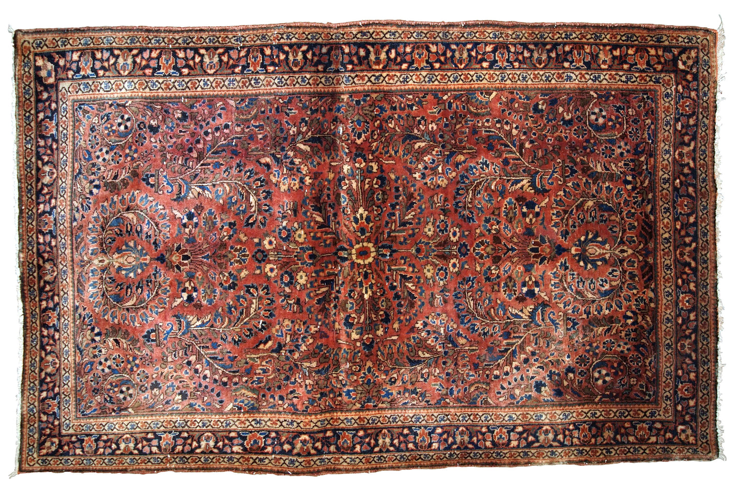 Hand-weaved antique Sarouk rug from the beginning of 20th century. The rug is in original good condition, made in classic floral design.
