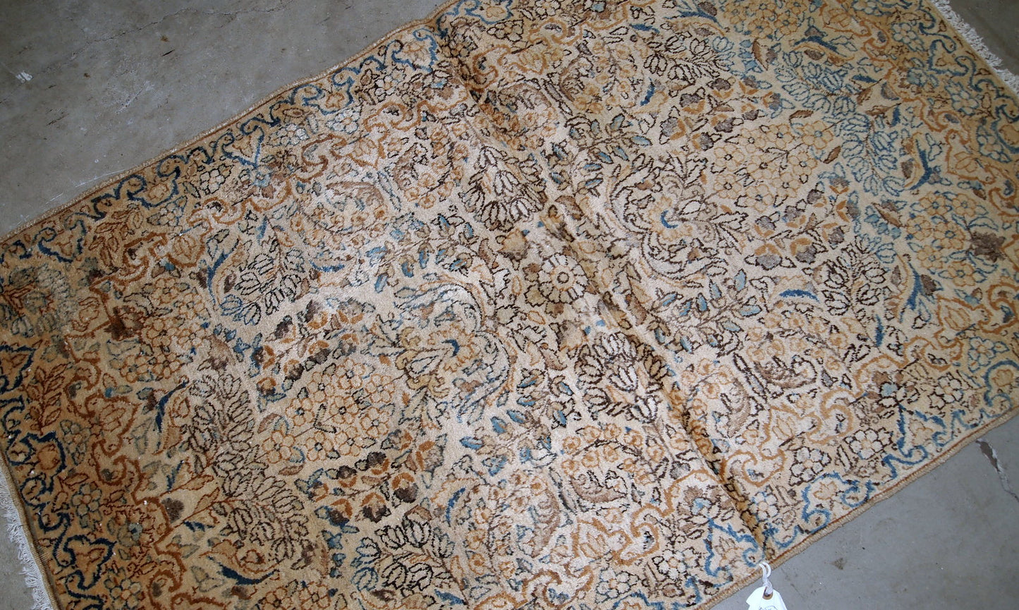 Handmade antique Kerman rug from the beginning of 20th century. The rug is in original good condition made in wool.