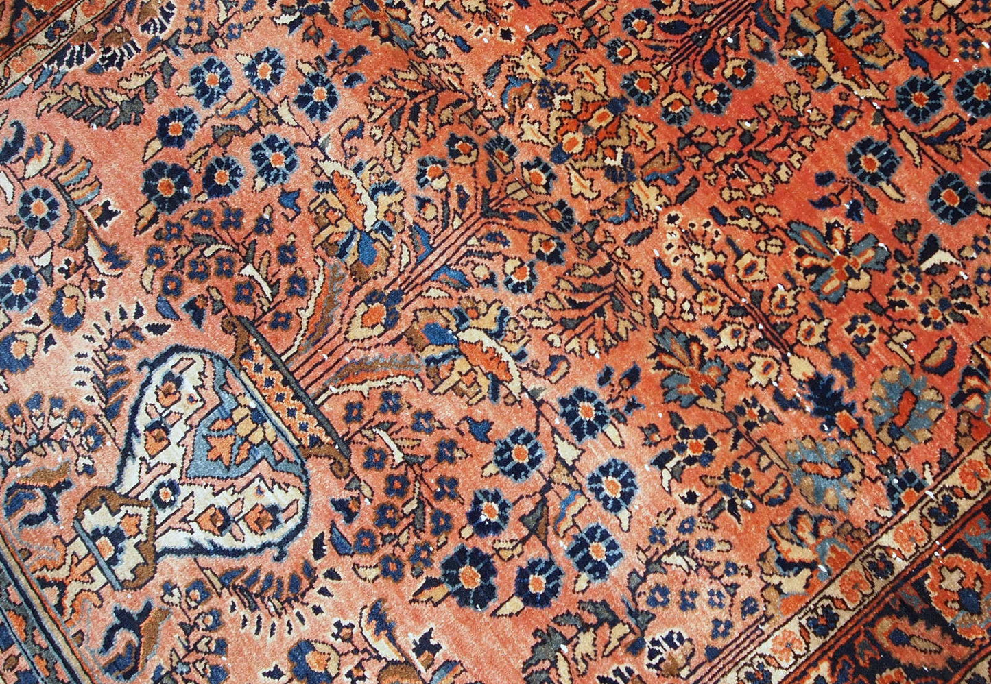 Hand-weaved antique Sarouk rug from the beginning of 20th century. The rug is in original good condition.
