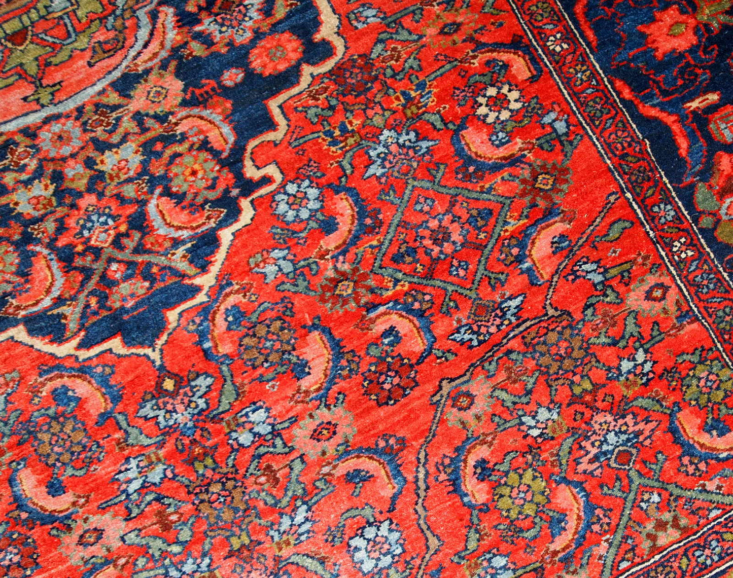 Handmade antique Bidjar rug from the beginning of 20th century. The rug is in original good condition made in bright red wool.
