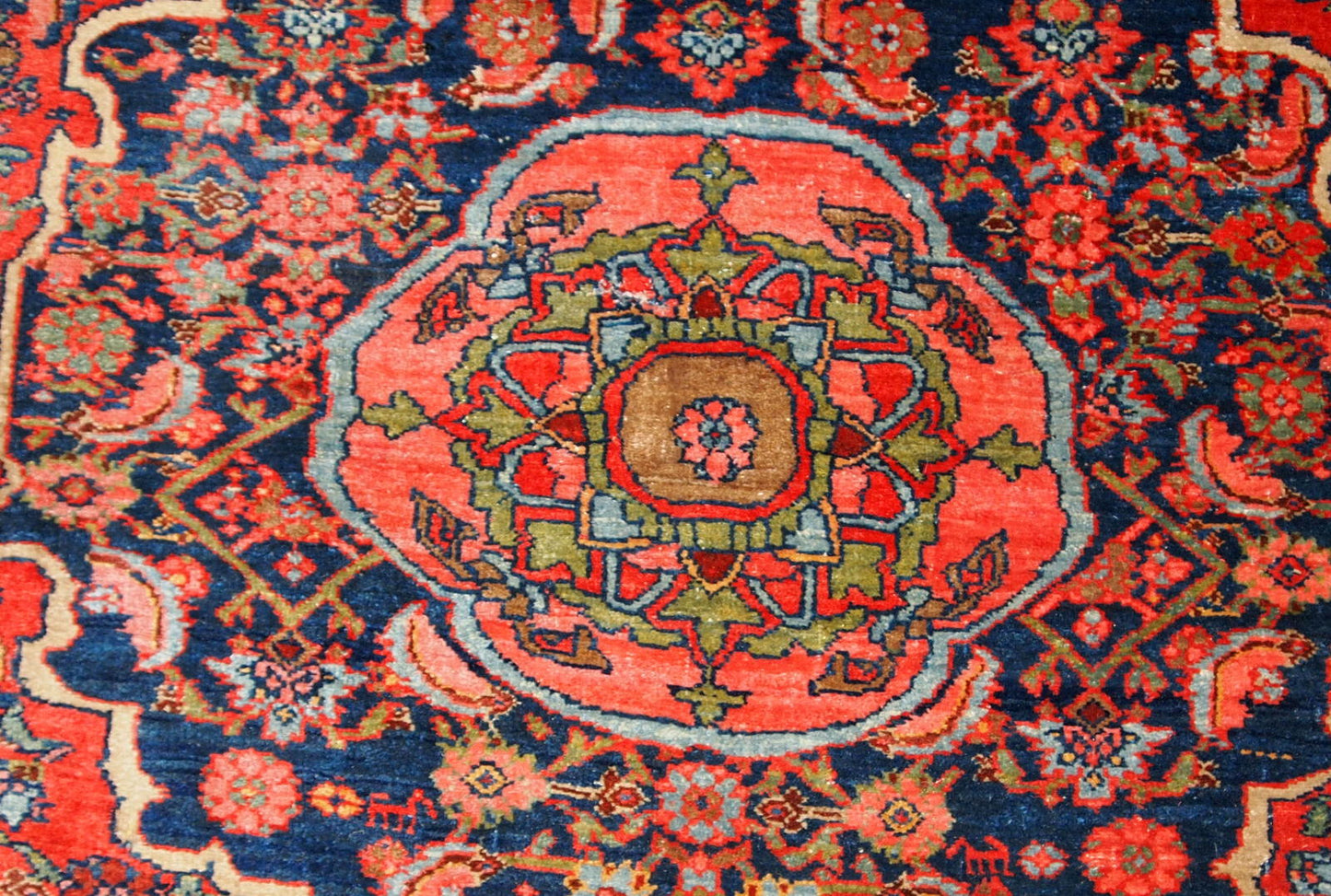 Handmade antique Bidjar rug from the beginning of 20th century. The rug is in original good condition made in bright red wool.
