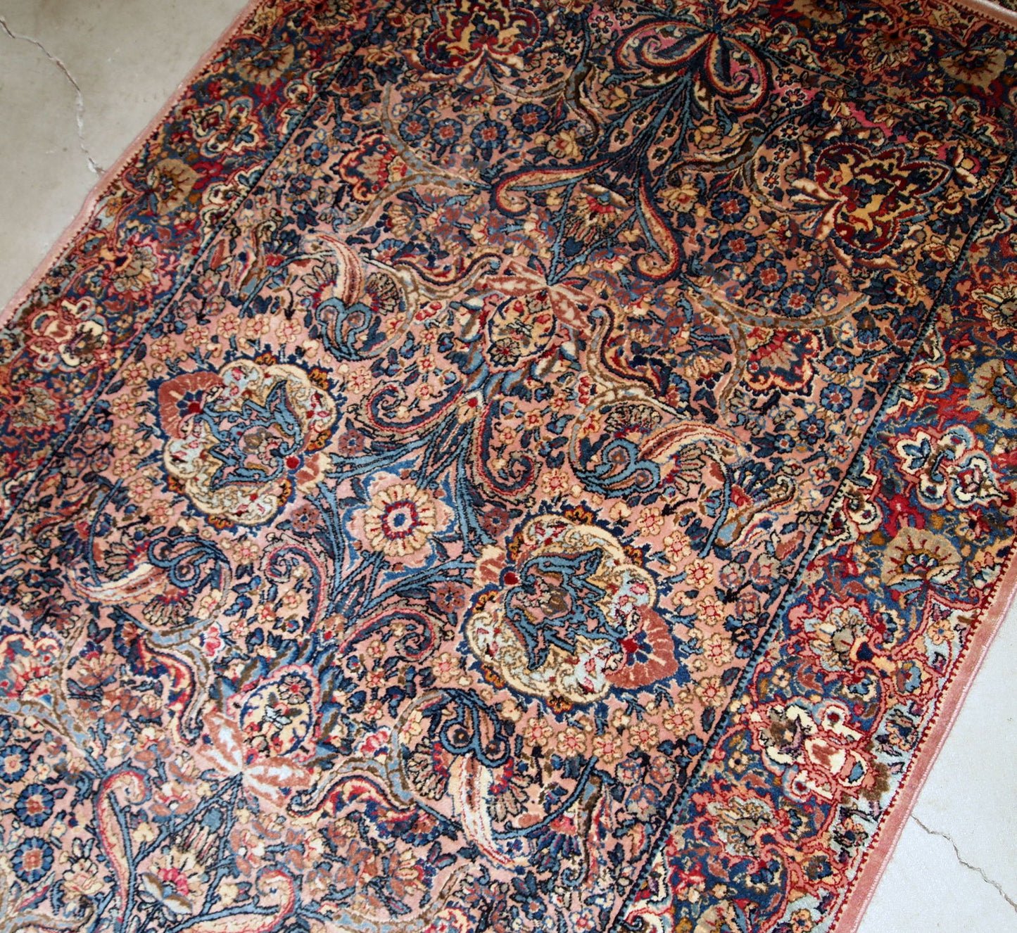 Hand made antique Persian Kerman rug in original good condition. The rug made in the beginning of 20th century in wool.