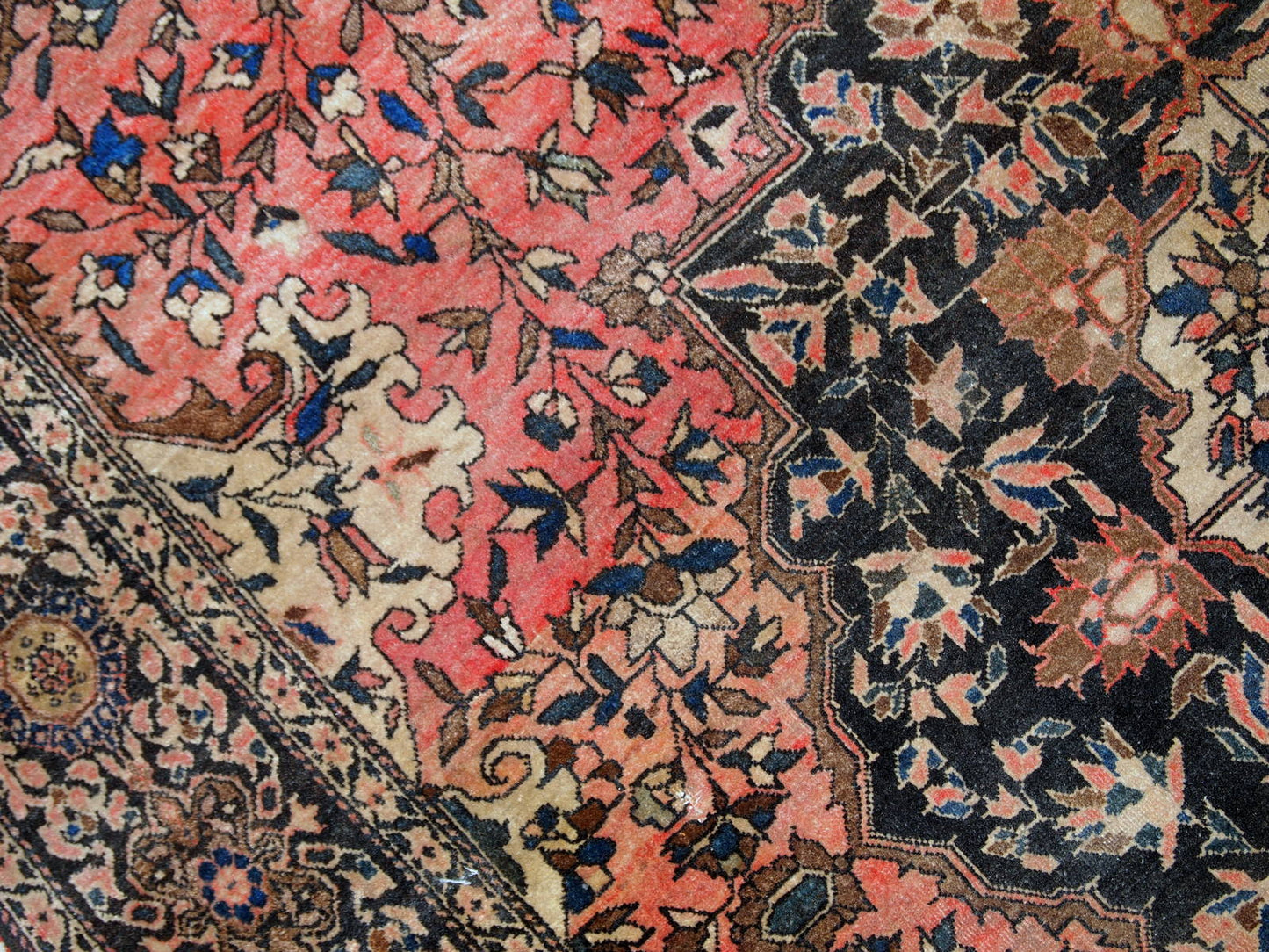 Handmade antique Persian Sarouk Farahan rug in original good condition. The rug is from the end of 19th century made in wool.