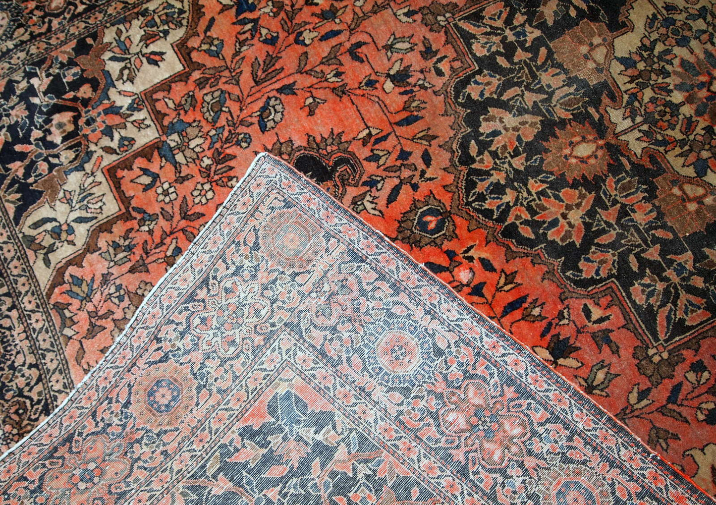 Handmade antique Persian Sarouk Farahan rug in original good condition. The rug is from the end of 19th century made in wool.