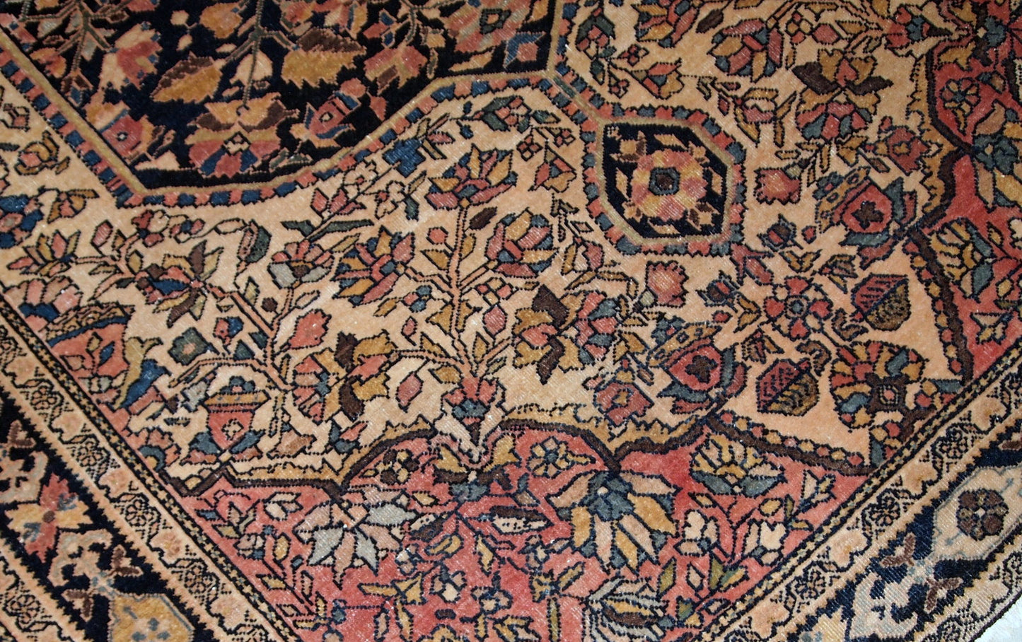 Handmade antique Sarouk Farahan rug in original good condition, has some low pile. The rug has been made in the beginning of 20th century.
