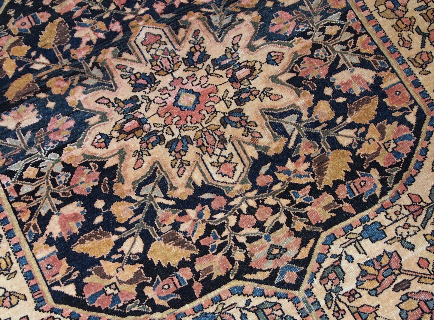 Handmade antique Sarouk Farahan rug in original good condition, has some low pile. The rug has been made in the beginning of 20th century.