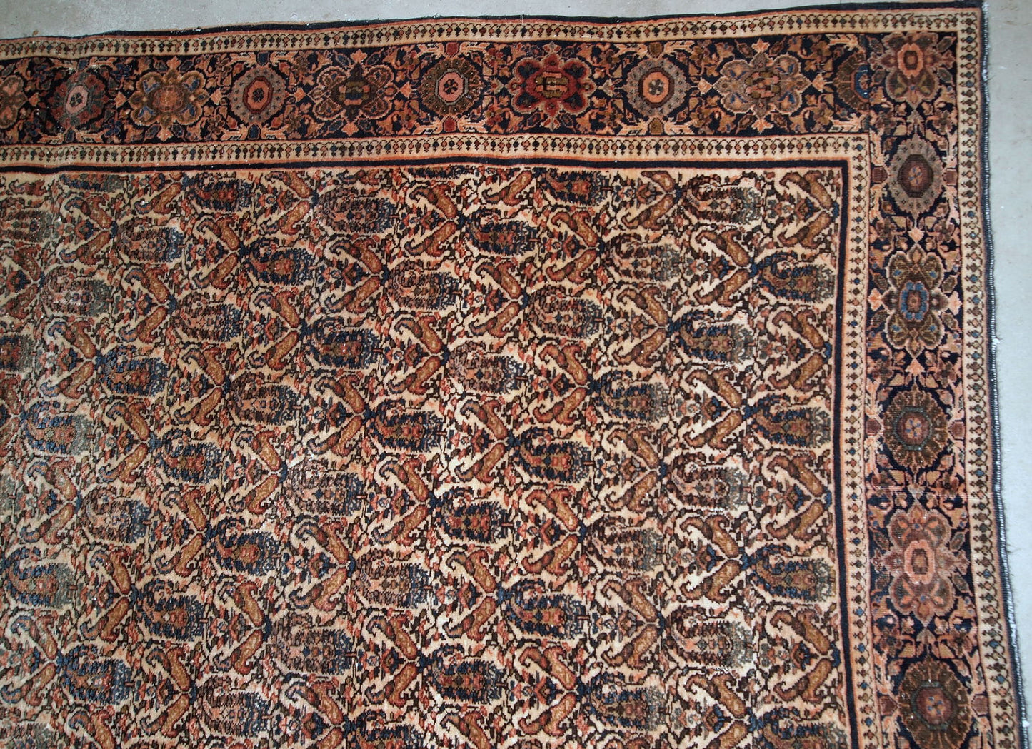 Handmade antique Farahan rug in original good condition. The rug has been made in the beginning of 20th century with all-over design.