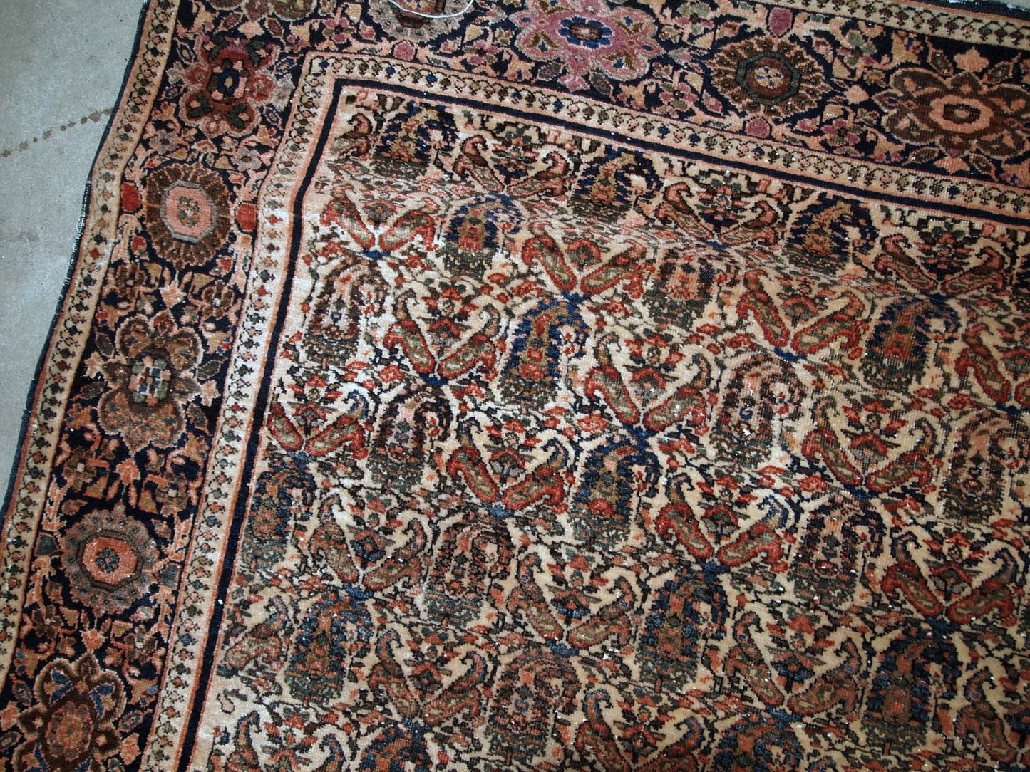 Handmade antique Farahan rug in original good condition. The rug has been made in the beginning of 20th century with all-over design.