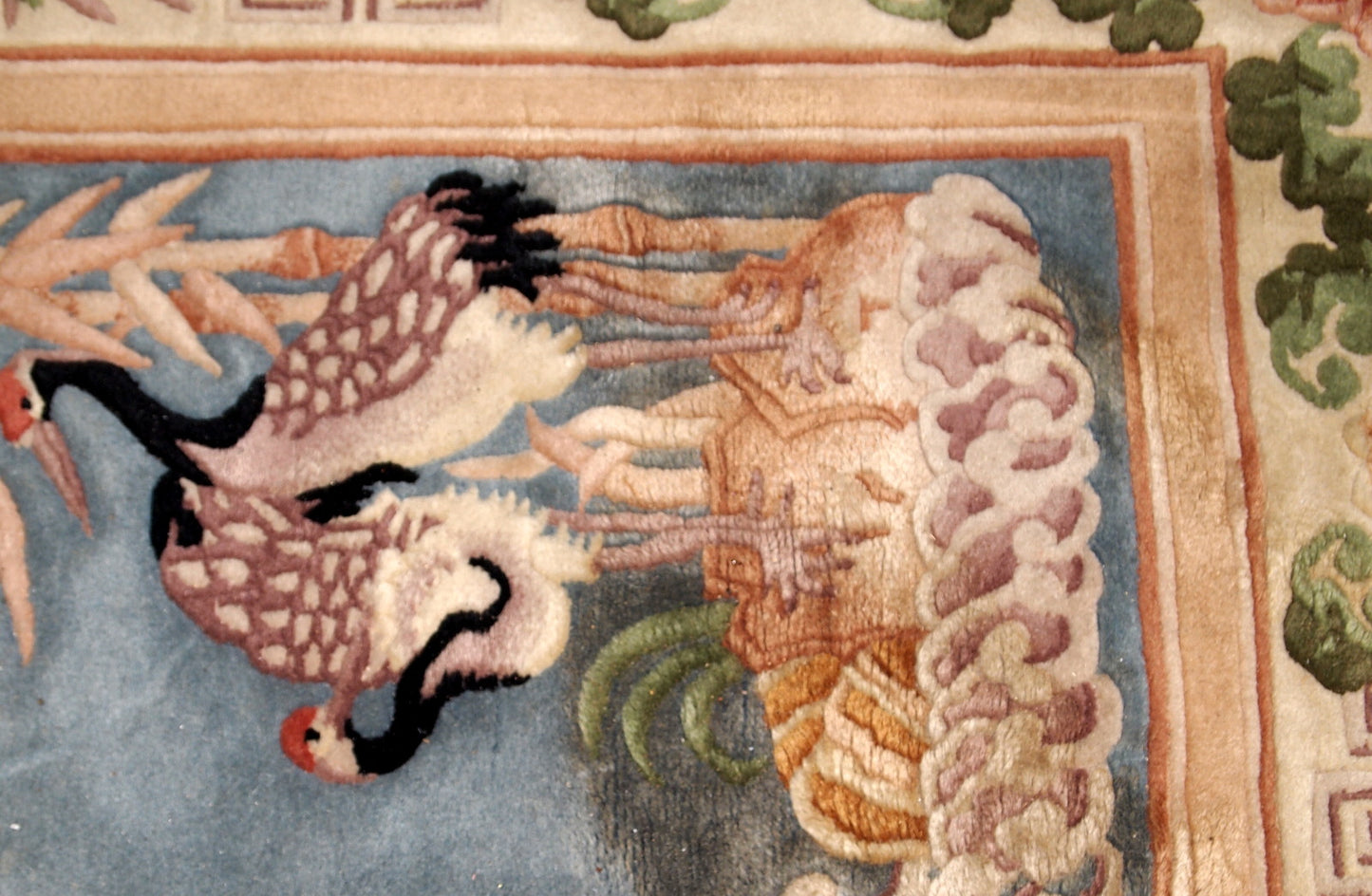 Handmade vintage Art Deco Chinese rug in sky blue and beige shades. The rug is from the beginning of 20th century in original condition, the rug has some stains.