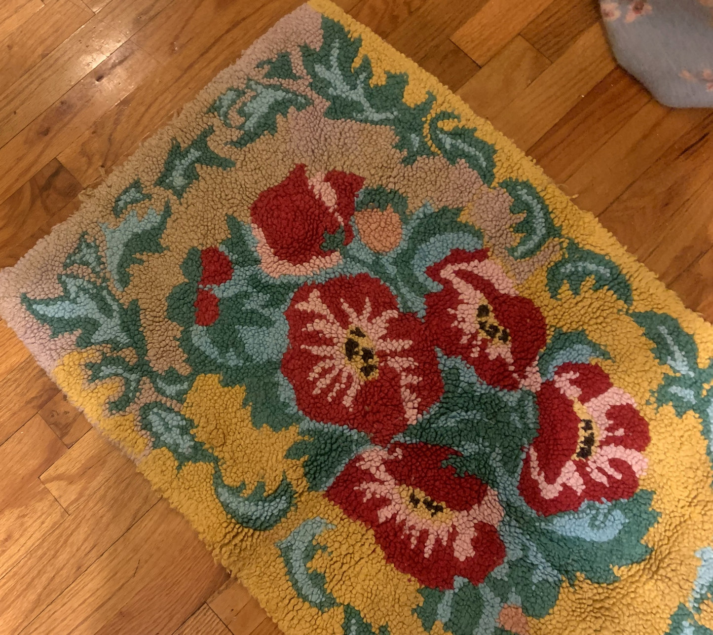 Handmade vintage American Hooked rug in floral design and yellow shade. The rug is from the middle of 20th century in original good condition.