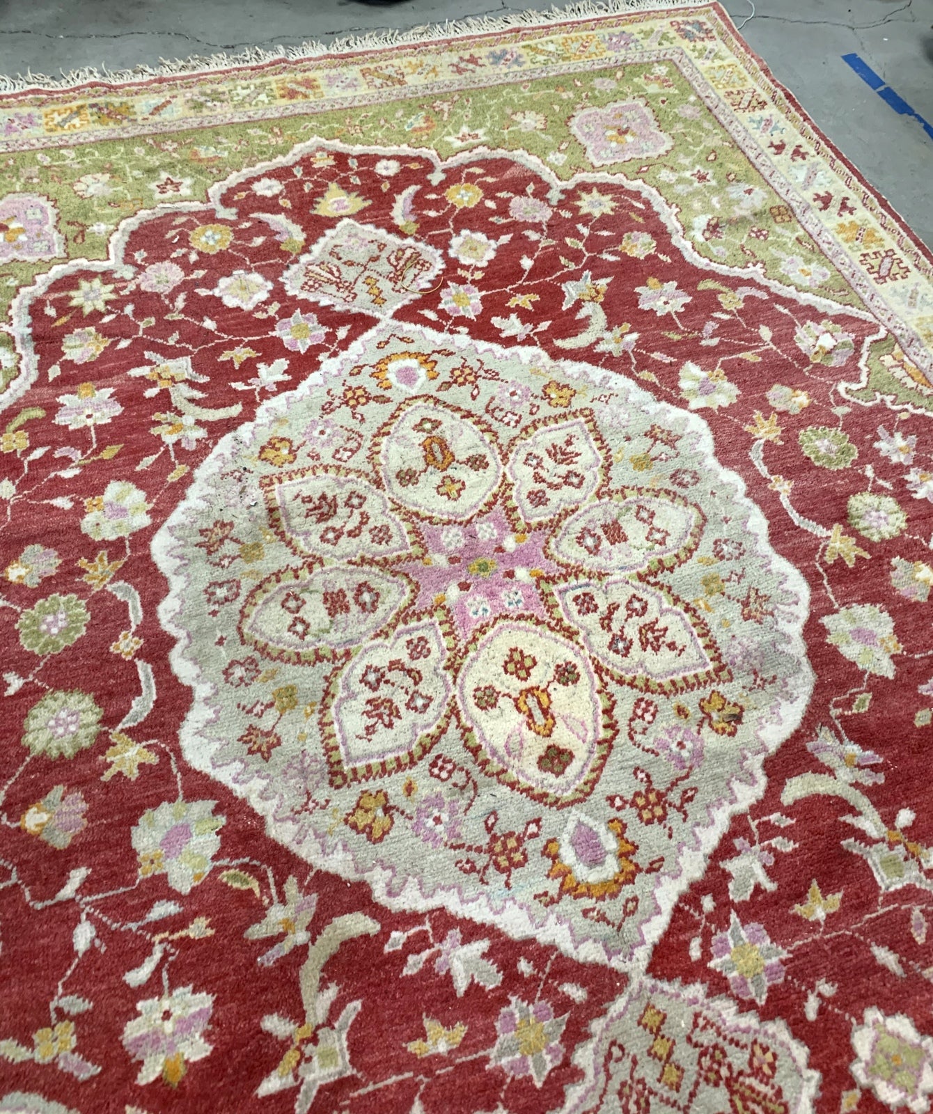 Handmade vintage Turkish Oushak rug in traditional design and natural dyes. The rug is from the beginning of 20th century in original good condition.