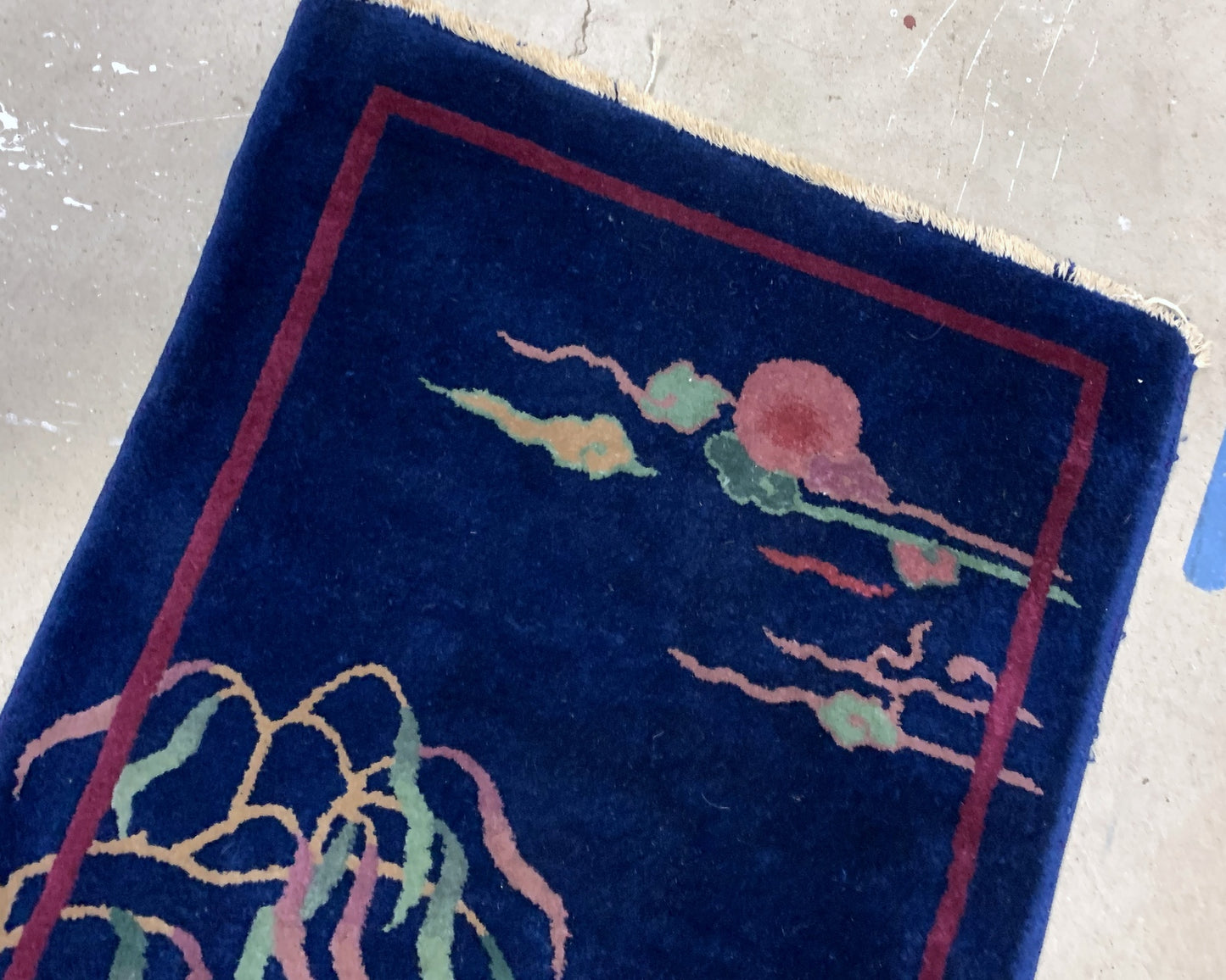 Handmade antique Art Deco Chinese rug in deep blue shade. The rug is from the beginning of 20th century in original condition.