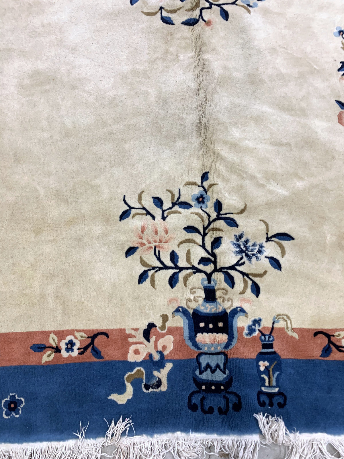Handmade vintage Art Deco Chinese rug in beige and blue shades. The rug is from the beginning of 20th century in original good condition.