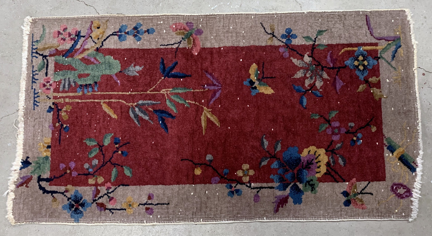 Handmade antique Art Deco Chinese rug in red shade. The rug is from the beginning of 20th century in original condition, it has some low pile.
