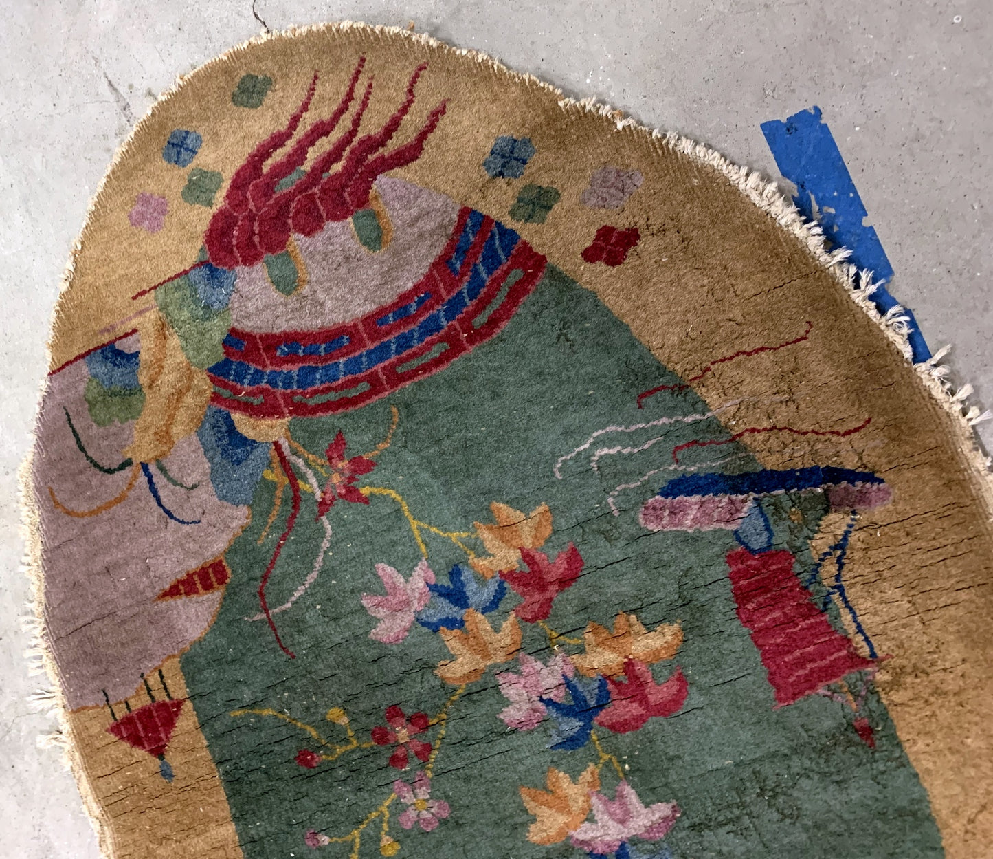 Handmade antique Art Deco Chinese rug in green and yellow shades. The rug is from the beginning of 20th century in original condition, it has some moth damages.