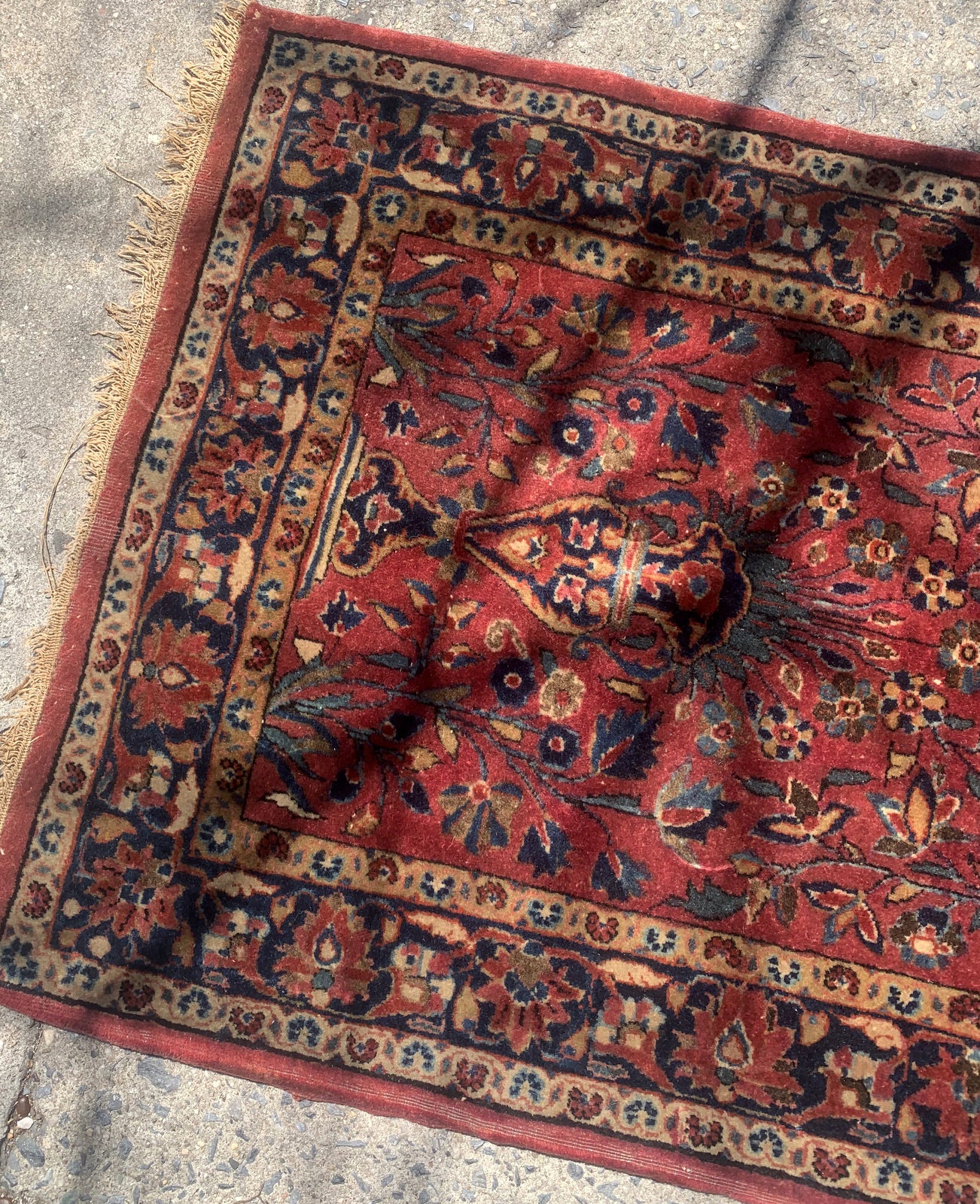 Handmade antique Persian Sarouk rug in red color. The rug is from the beginning of 20th century in original condition, it has some low pile. This rug is prayer.