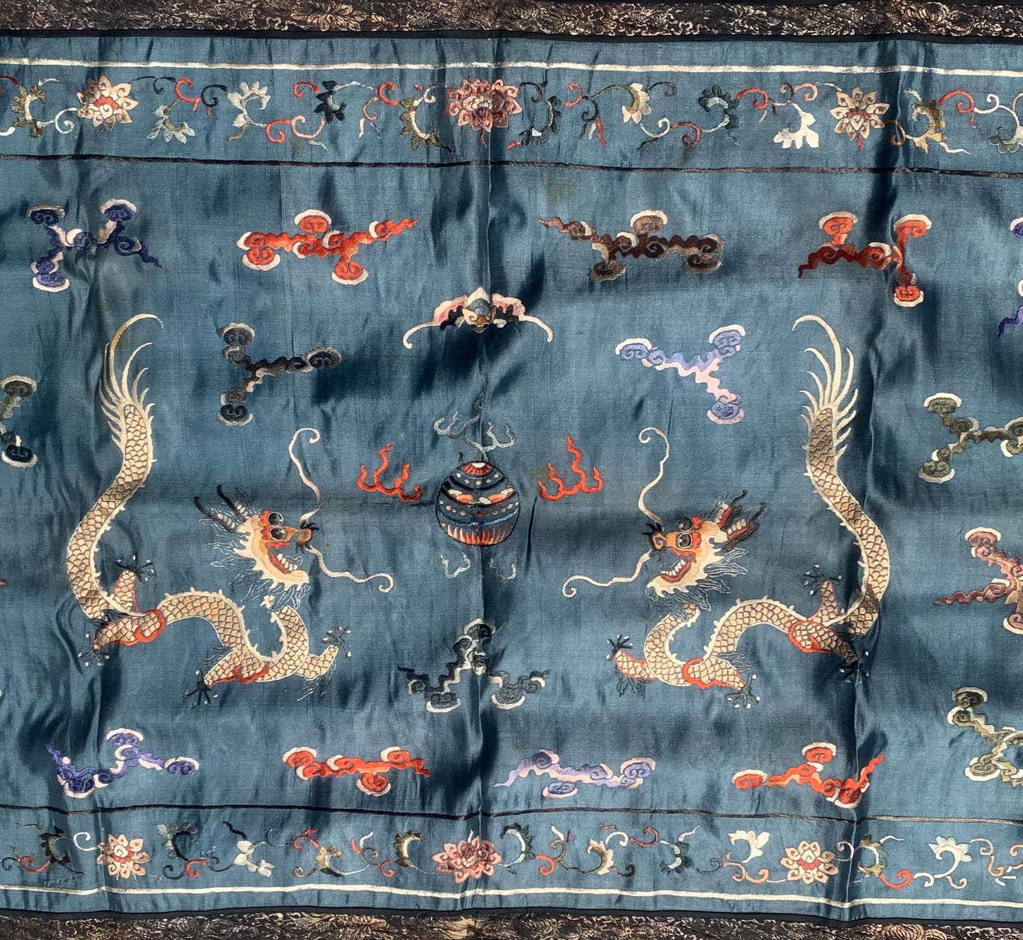 Handmade antique Chinese Dragon designed textile in silk. This tapestry is from the end of 19th century in original condition, it has some age discolorations.