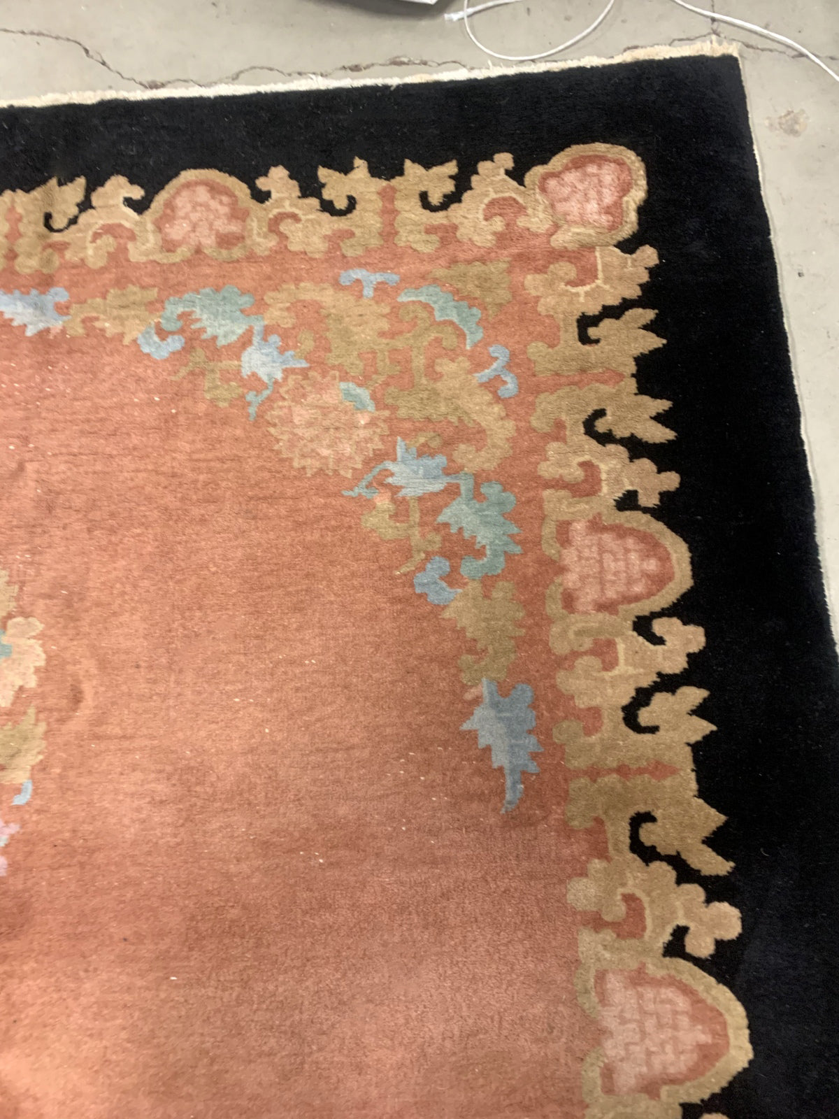 Handmade antique Art Deco Chinese rug in pink and black colors. The rug is from the beginning of 20th century in original condition, it has some low pile areas.