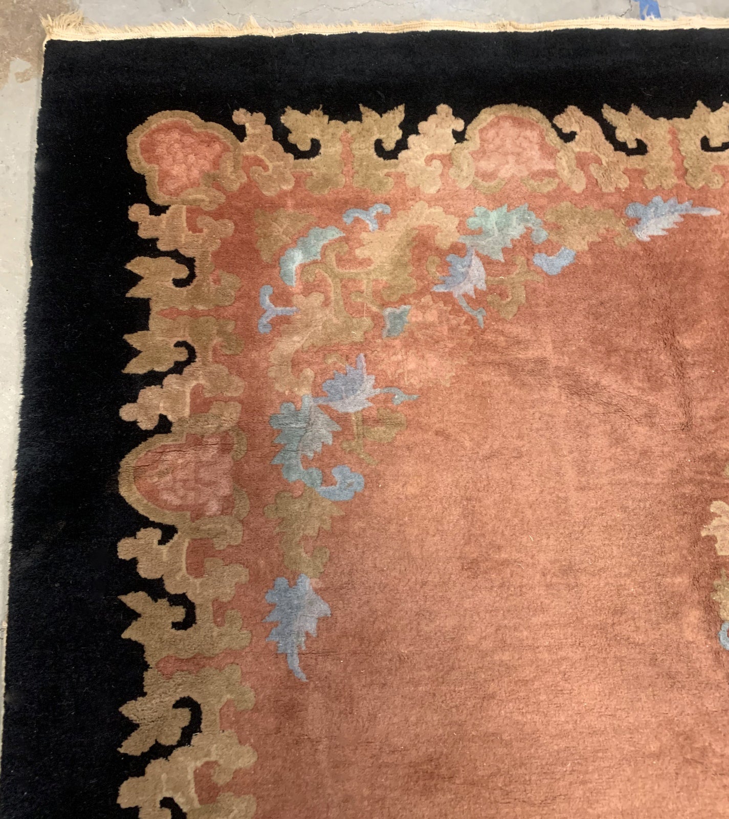 Handmade antique Art Deco Chinese rug in pink and black colors. The rug is from the beginning of 20th century in original condition, it has some low pile areas.