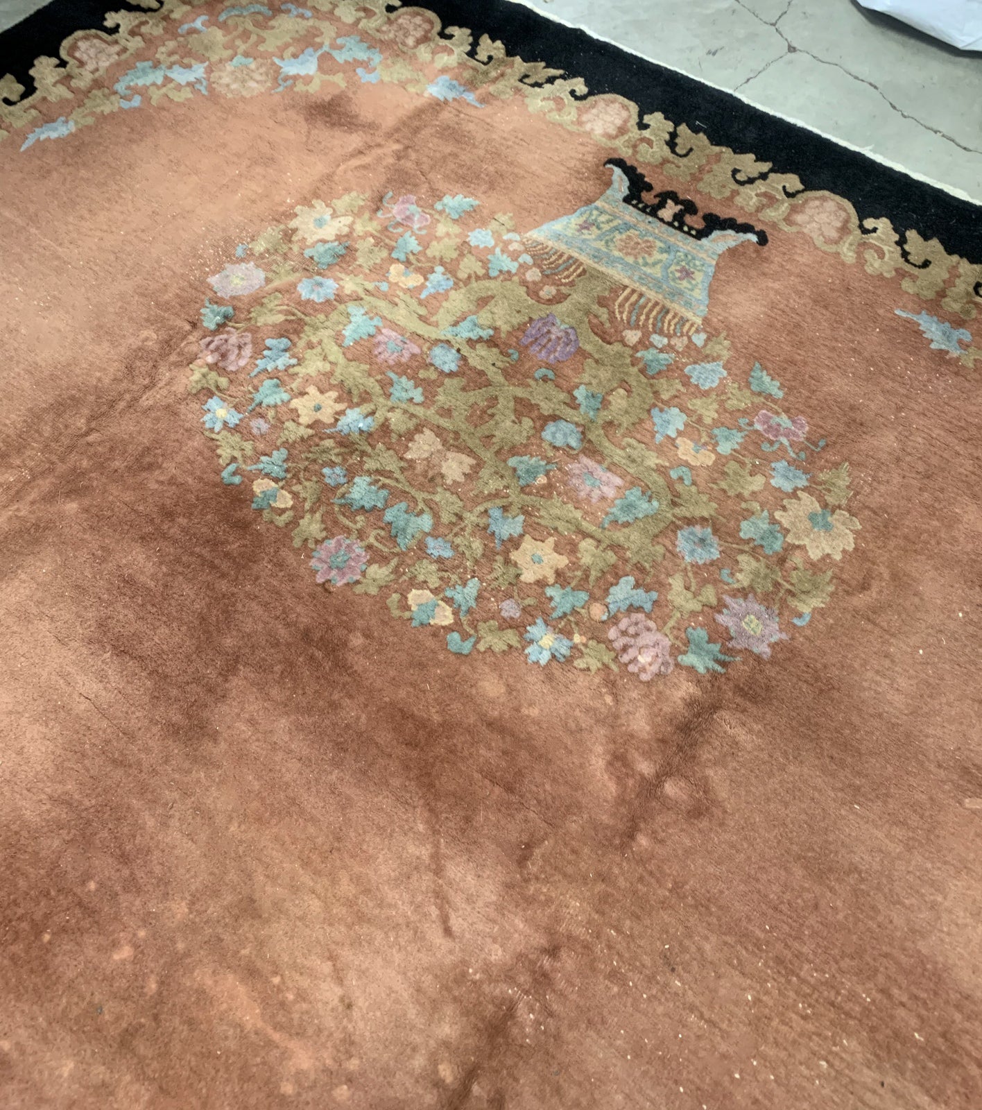 Handmade antique Art Deco Chinese rug in pink and black colors. The rug is from the beginning of 20th century in original condition, it has some low pile areas.