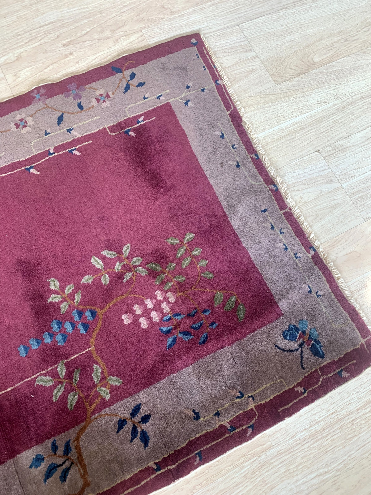 High-quality images of the antique Chinese rug featuring its intricate geometric patterns and rich color palette