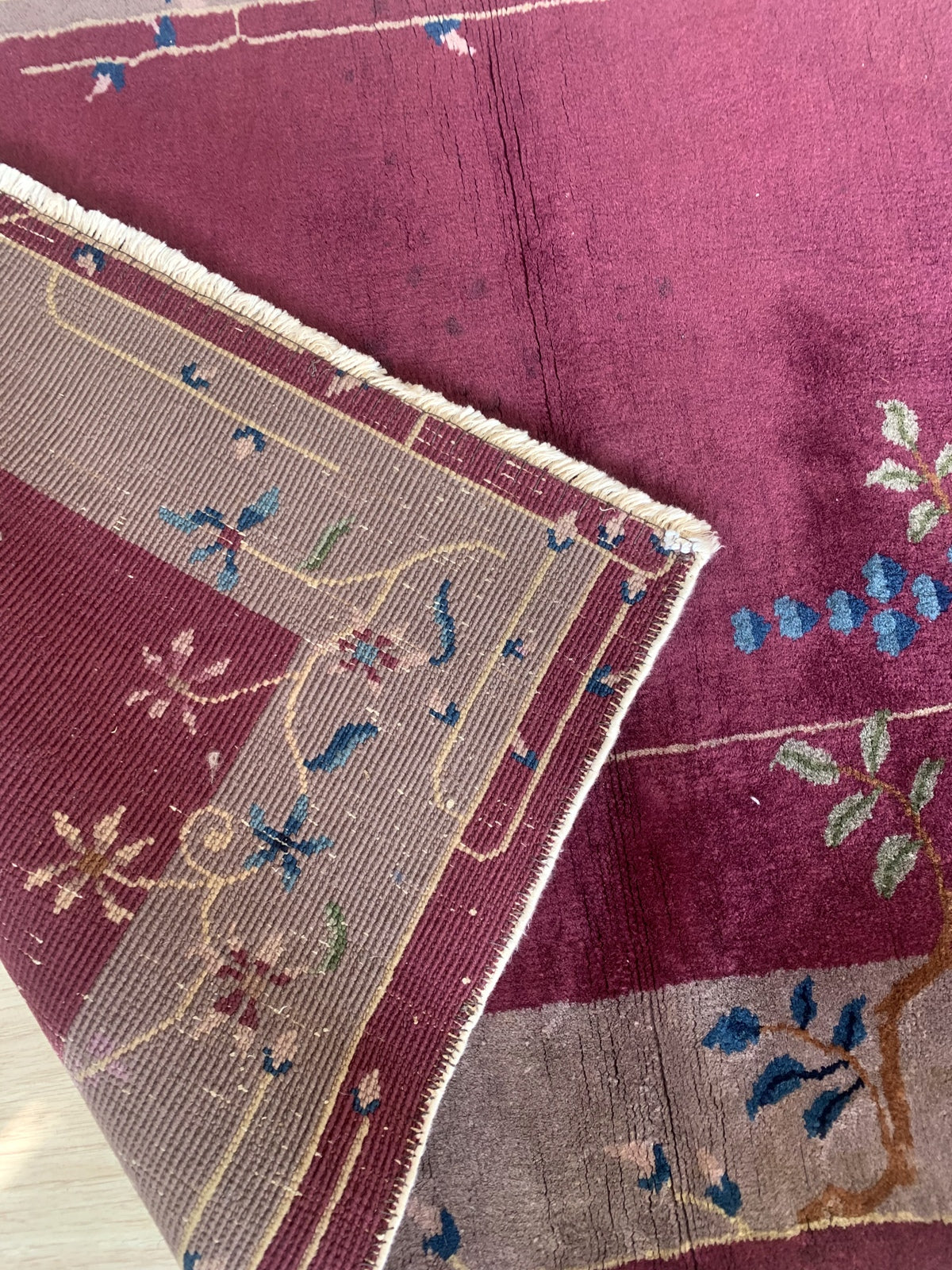Authentic reverse side of the handmade Art Deco Chinese rug with handwoven details and vintage charm