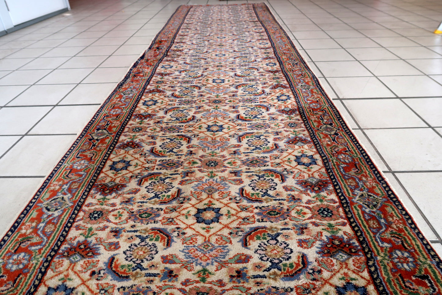 Handmade vintage Persian Mahal runner in all-over design. The runner is from the end of 20th century in good condition, it has some old restoration on one part of the border.