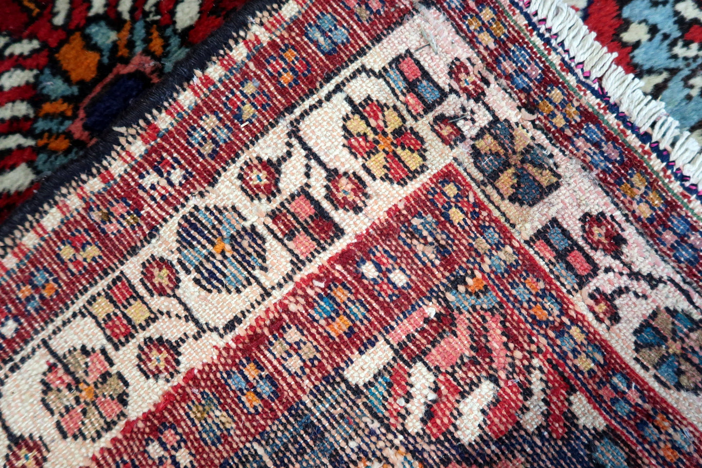 Handmade vintage Persian Hamadan rug with large medallion design and bright colors. The rug is from the end of 20th century in original good condition.