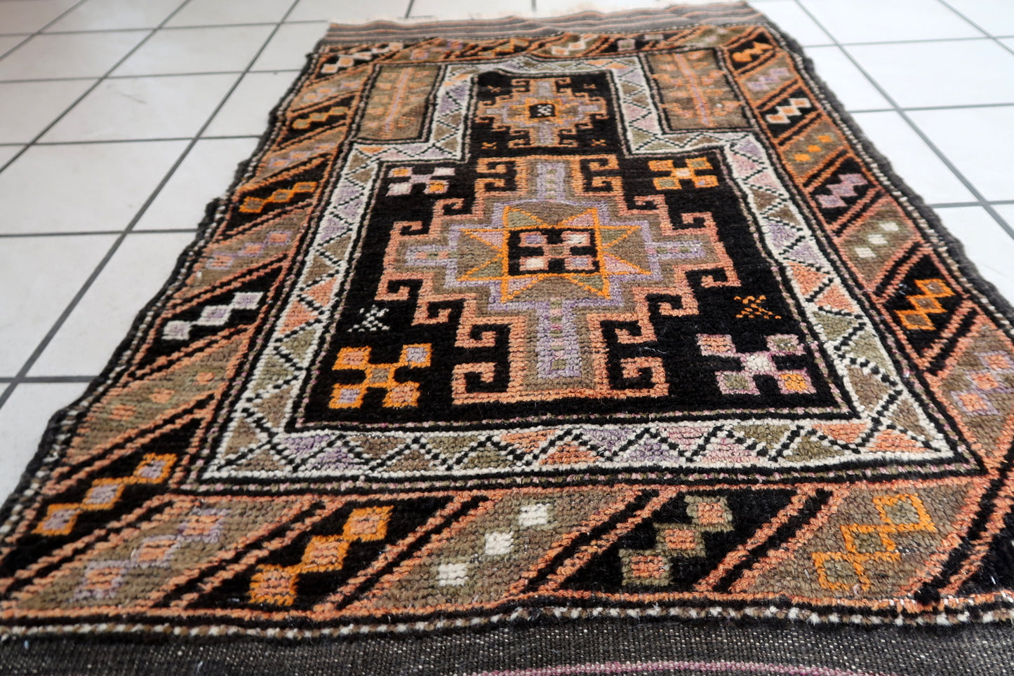 Handmade antique collectible Afghan Baluch rug in tribal prayer design. The rug is from the middle of 20th century in original good condition.