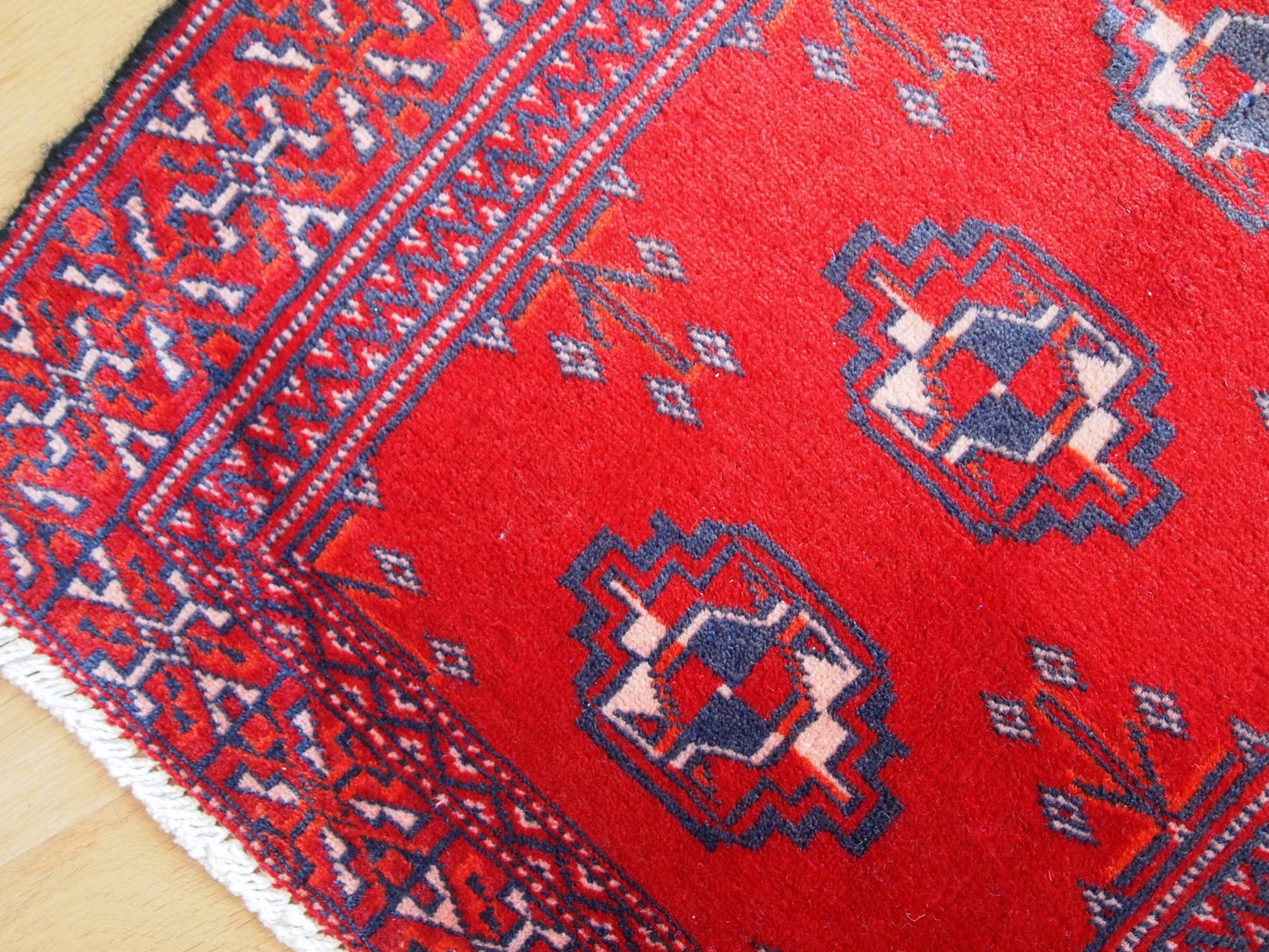 Close-up of the purple tribal motif on the Turkmen Rug.