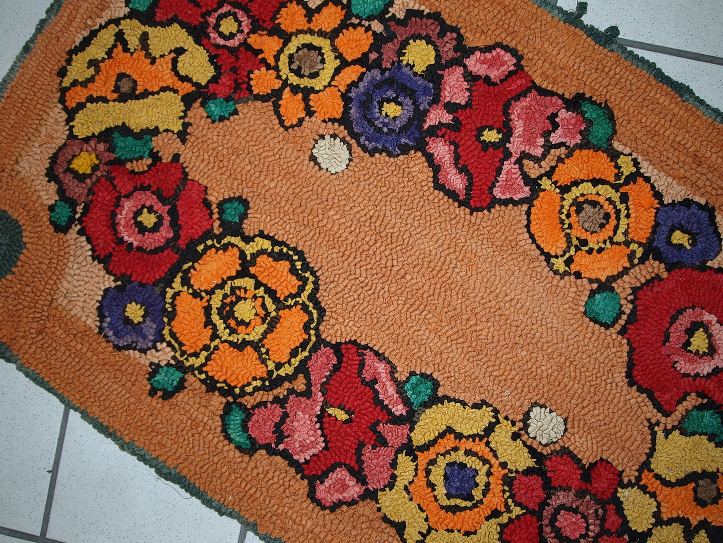 Wool fibers and texture detail of the vintage hooked rug