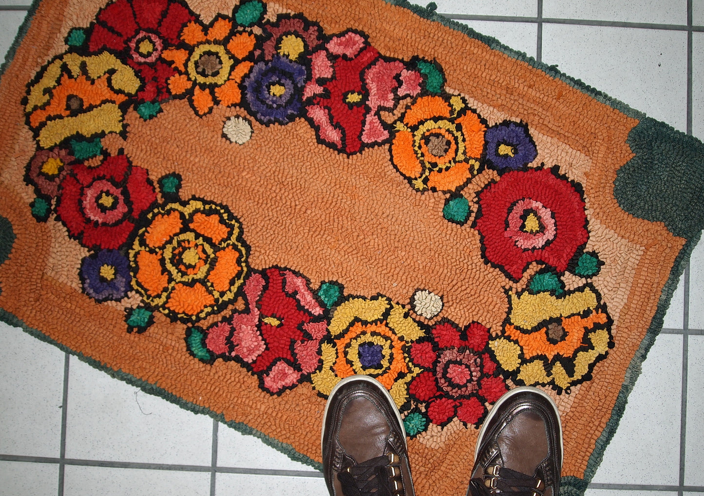 Wool fibers and texture detail of the vintage hooked rug