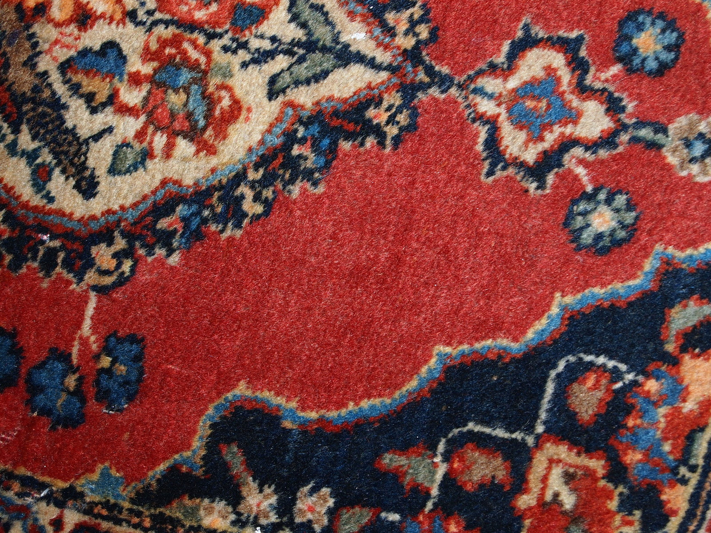Antique Tabriz double mat in original good condition, one of the rugs has some low pile. The design is traditional with decorative birds in the center.