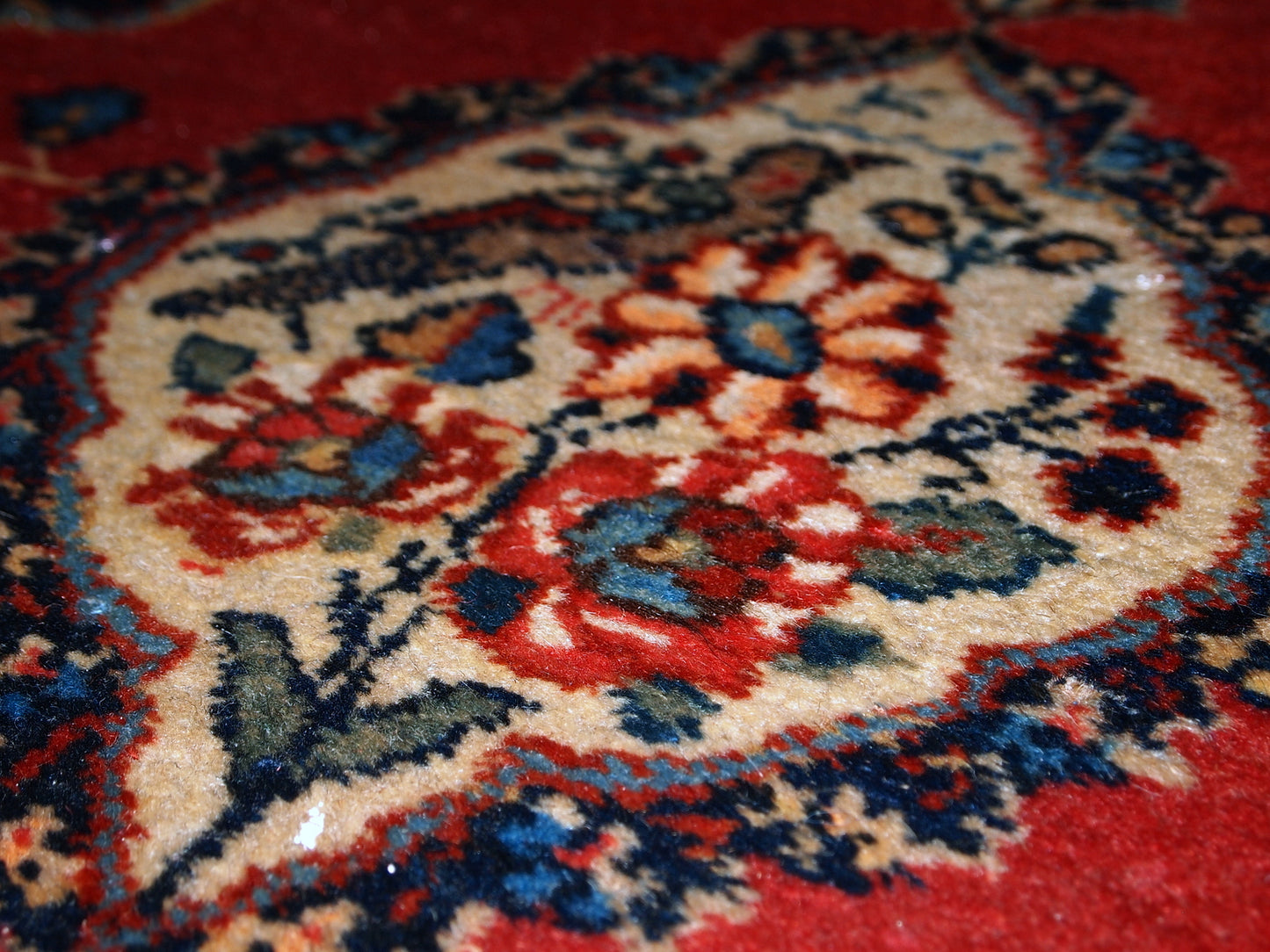 Antique Tabriz double mat in original good condition, one of the rugs has some low pile. The design is traditional with decorative birds in the center.