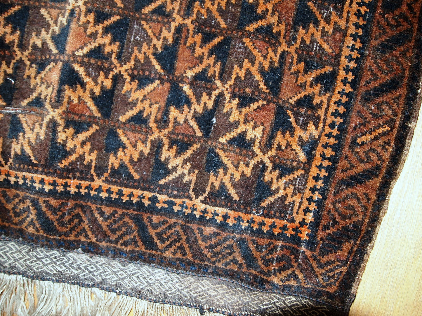 Antique hand made Afghan Baluch bag face in original condition, has some age wear and a little bit crooked. The main colors on this rug is orange, also has some different shades of brown.