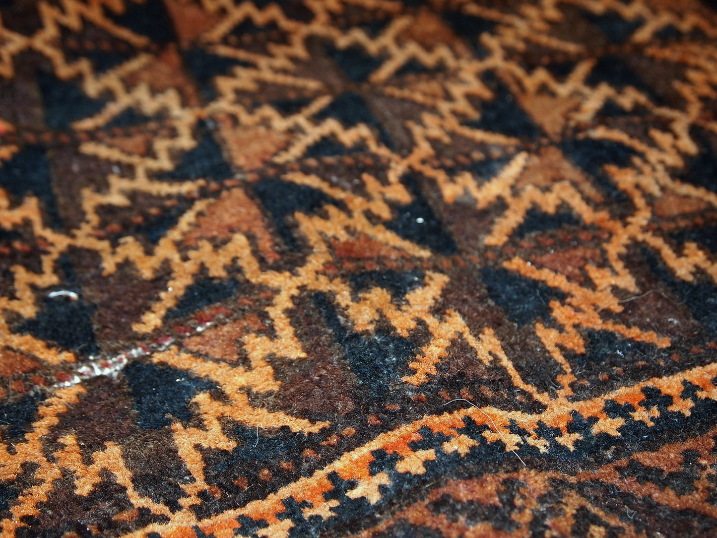 Antique hand made Afghan Baluch bag face in original condition, has some age wear and a little bit crooked. The main colors on this rug is orange, also has some different shades of brown.