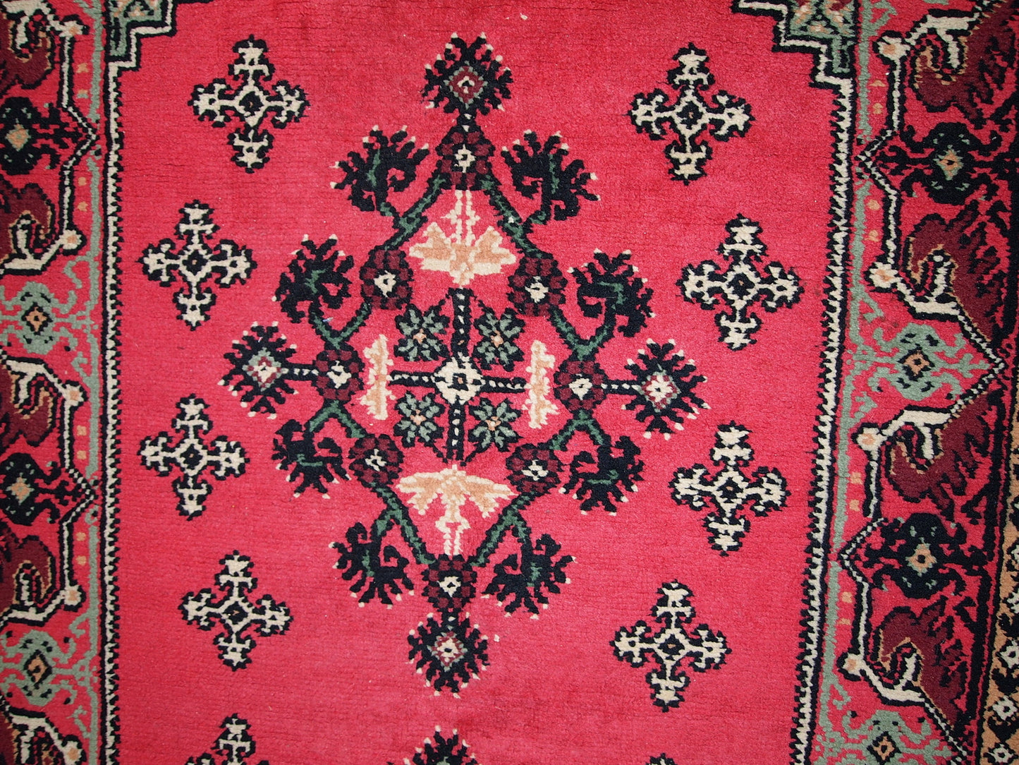 Vintage Algerian Berber rug in original good condition. This rug is from the end of 20th century made in pink wool.