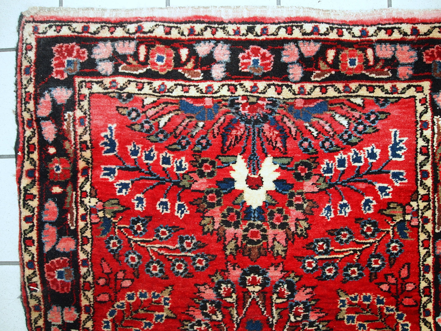 Hand made antique Persian Lilihan runner in original condition, it has several areas with low pile. This runner is heavy, it has been made in the beginning of 20th century.