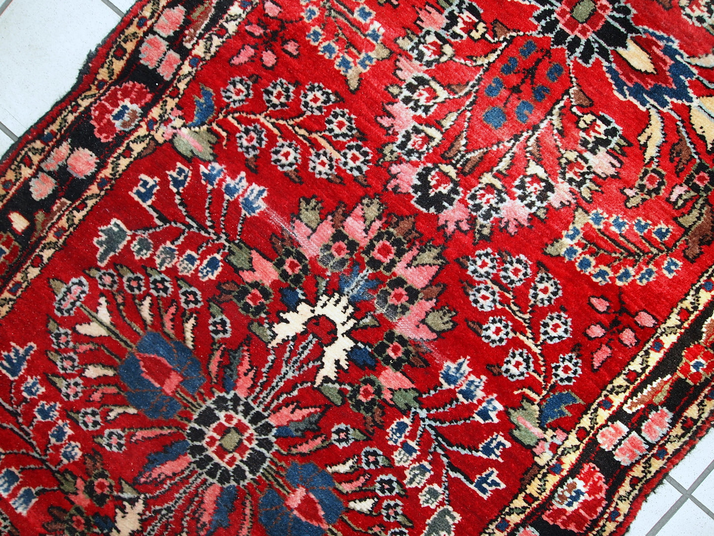 Hand made antique Persian Lilihan runner in original condition, it has several areas with low pile. This runner is heavy, it has been made in the beginning of 20th century.